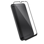 Three-quarter angled view device with screen protector hovering above screen.