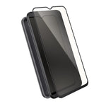 Three-quarter view of phone with case behind phone and screen protector above device screen.