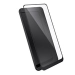 Three-quarter angled view device with screen protector hovering above screen.